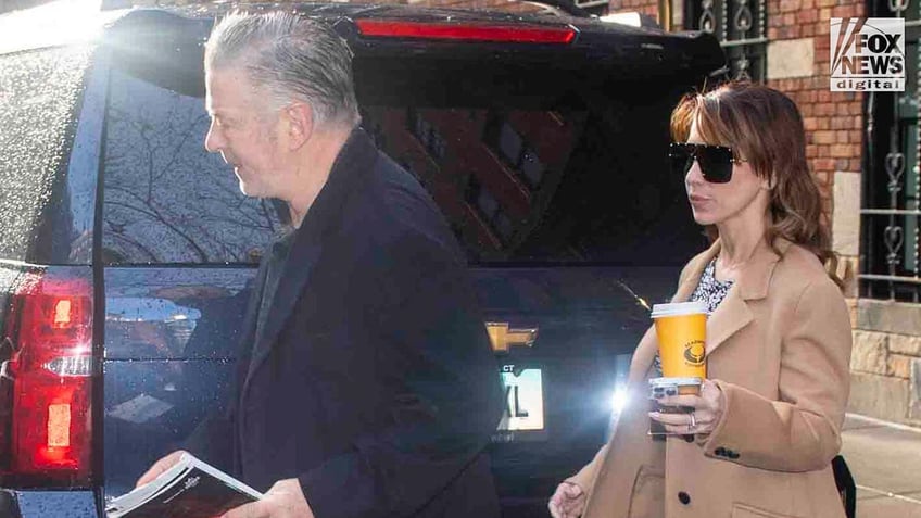 Alec Baldwin, who faces charges of involuntary manslaughter, gets into a car with wife, Hilaria Baldwin