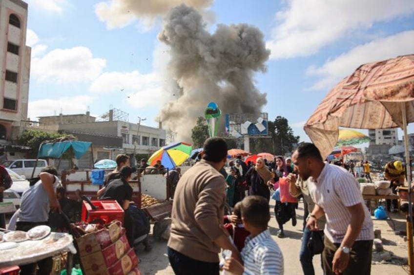 Gaza continues to be pounded by Israeli strikes, with negotiations over a truce in Cairo s