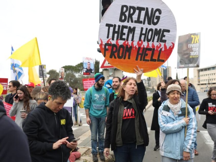 JERUSALEM - FEBRUARY 11: Relatives of Israeli hostages and their supporters, holding banne