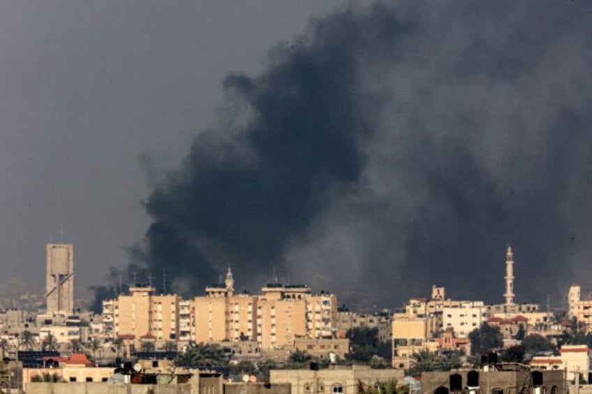 Smoke billows over Khan Yunis in the southern Gaza Strip during Israeli bombardment