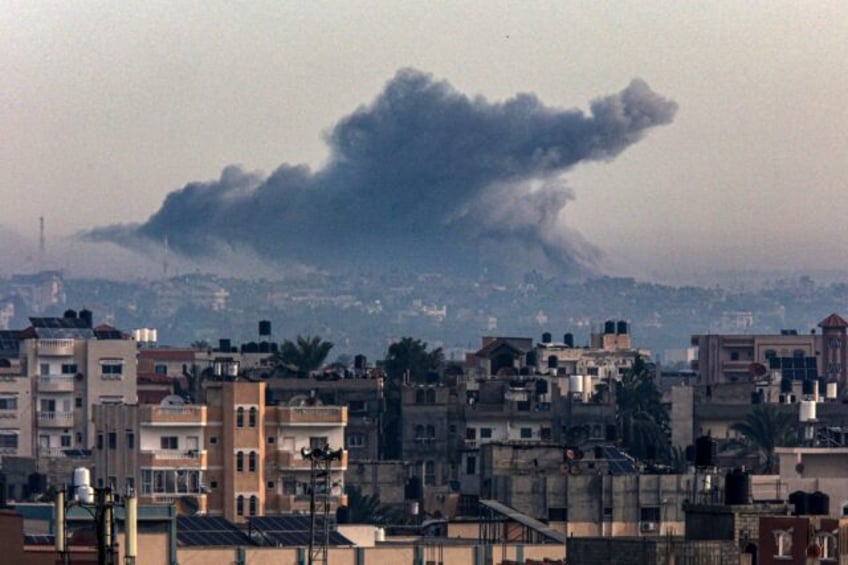 Smoke rises over Khan Yunis in the southern Gaza Strip during Israeli bombardment on December 20, 2023