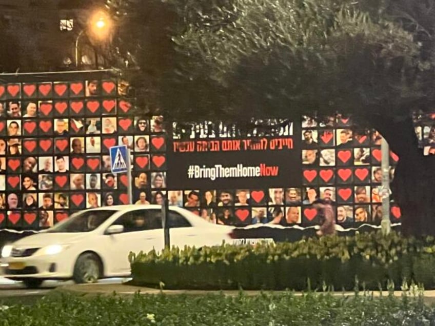 A display of Israeli hostages in Jerusalem, Israel, with those already released marked with hearts, February 5, 2023 (Joel Pollak / Breitbart News)