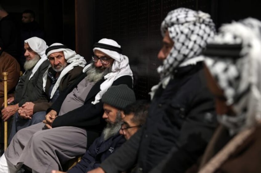 Palestinian families in Ramallah, the occupied West Bank, after Israel delayed the release