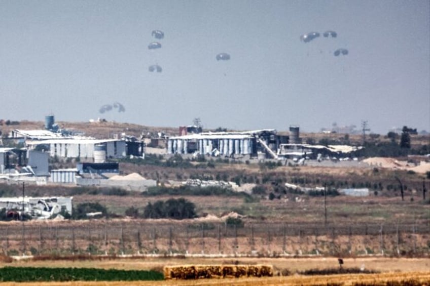 Humanitarian aid is airdropped over the Gaza Strip on May 9 as relief agencies warn of a l