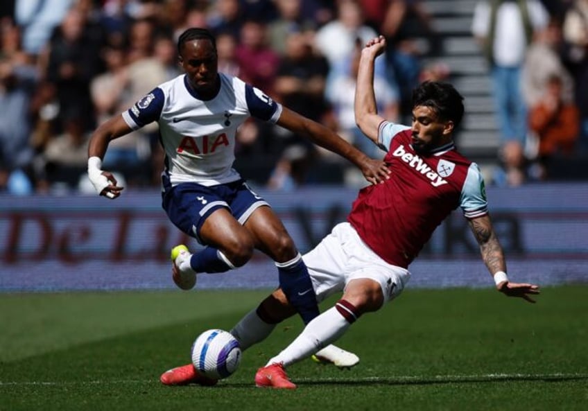 No crying shame: West Ham midfielder Lucas Paqueta (R) vies with Tottenham striker Mathys