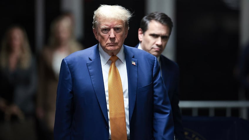 NEW YORK, NEW YORK - MAY 07:  Former U.S. President Donald Trump walks to speak to the press at the end of the day during his trial for allegedly covering up hush money payments at Manhattan Criminal Court on May 7, 2024 in New York CitY. 