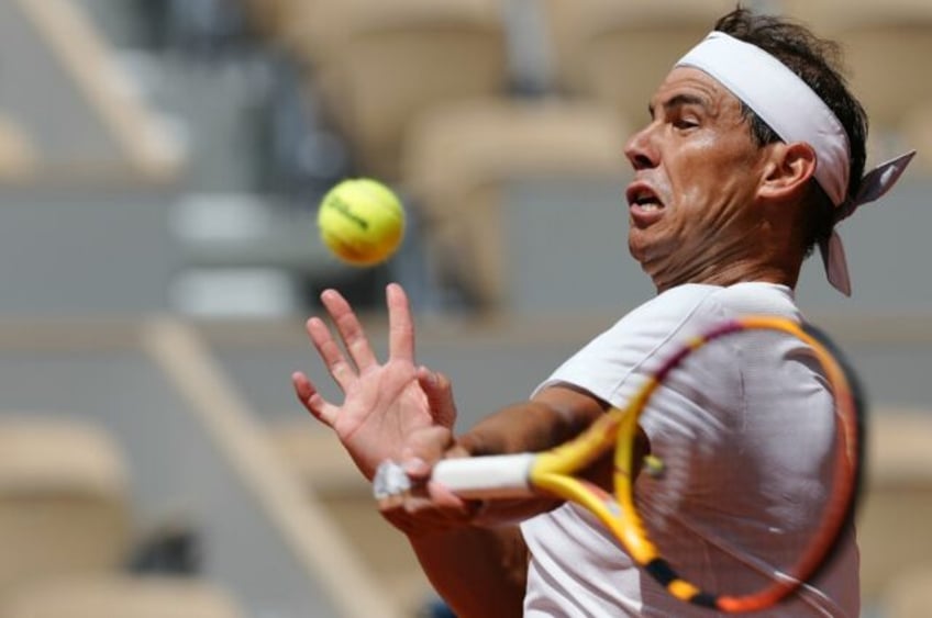 No laughing matter: Rafael Nadal takes part in a practice session ahead of the French Open