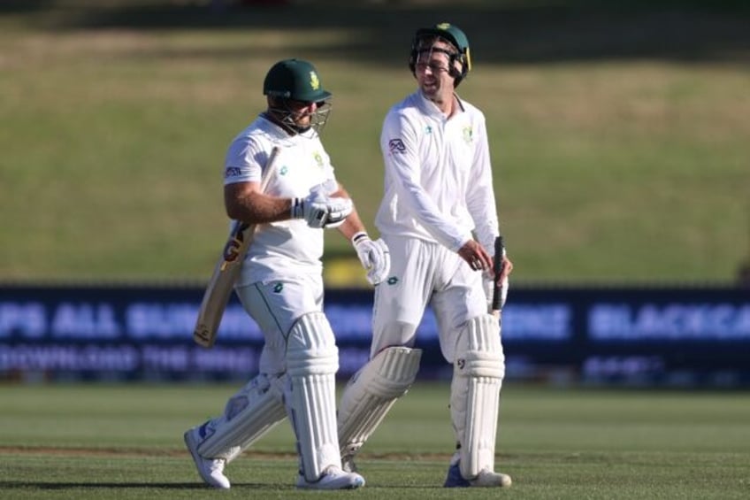 South Africa's Ruan de Swardt (right) and Shaun von Berg (L) walk off the field at stumps