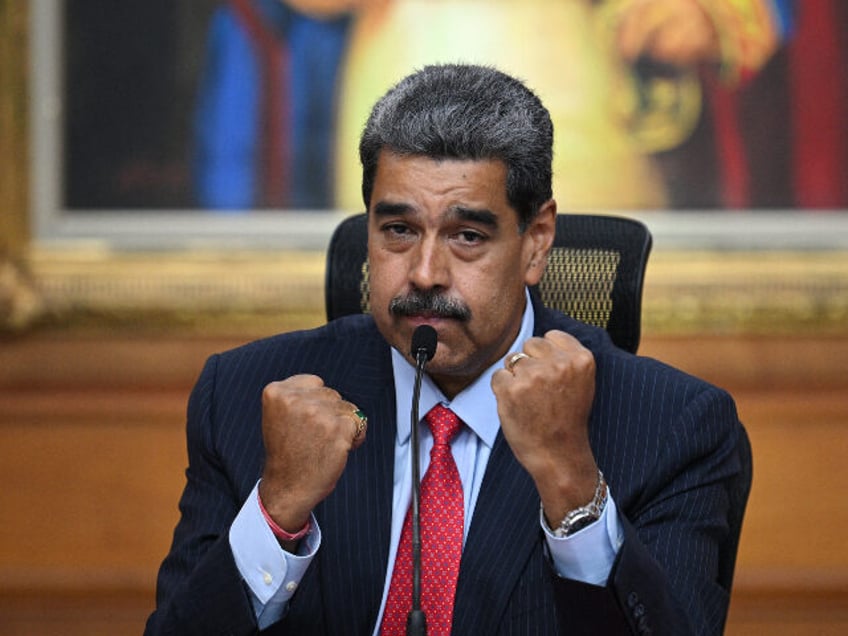 Venezuelan President Nicolas Maduro gestures during a press conference to the internationa