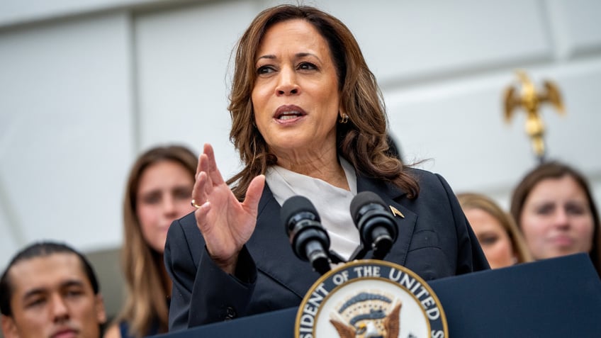 Harris speaking at lectern