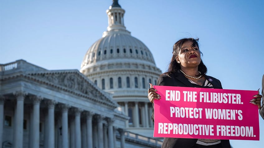 Rep. Sean Casten, D-Ill., speaks with other Democratic lawmakers during a press conference to call on Senators to end the filibuster for abortion rights on Capitol Hill on Tuesday, May 10, 2022 in Washington, D.C.