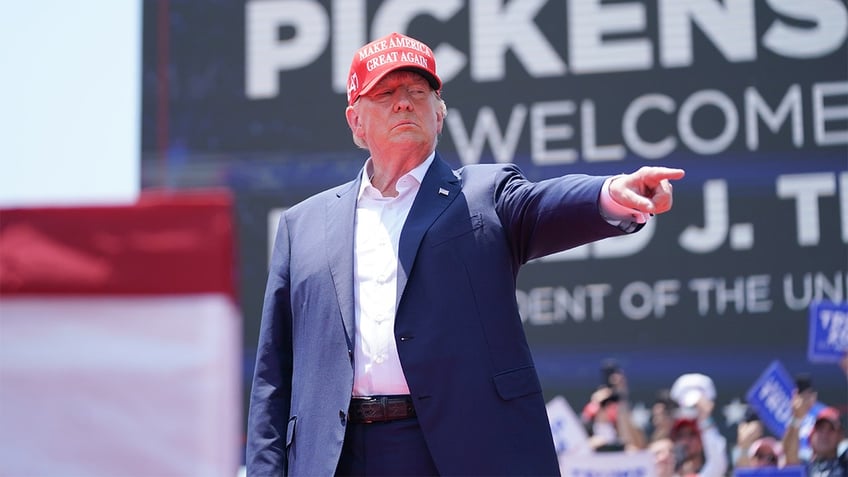 Former President Donald Trump pointing at rally