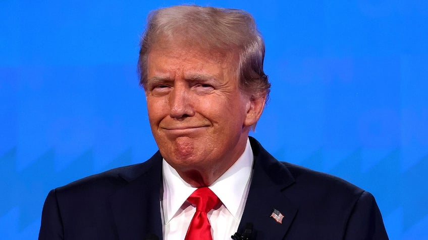 Republican presidential candidate, former U.S. President Donald Trump reacts during the CNN Presidential Debate at the CNN Studios on June 27, 2024, in Atlanta.