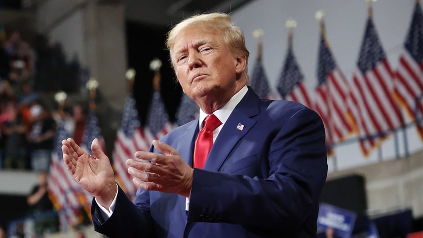 Former President Donald Trump clapping