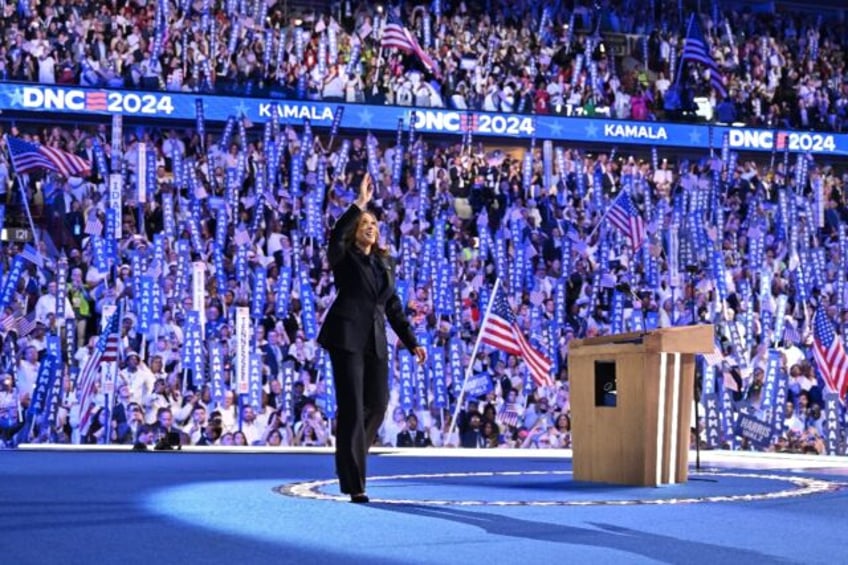 US Vice President and 2024 Democratic presidential candidate Kamala Harris waves as she ar