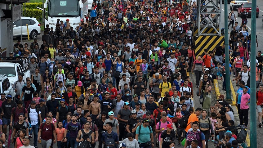 Latin American migrants take part in a caravan towards the border with the United States, in Huehuetan, Chiapas state, Mexico, on June 7, 2022. - (Photo by Isaac GUZMAN / AFP) (Photo by ISAAC GUZMAN/AFP via Getty Images)