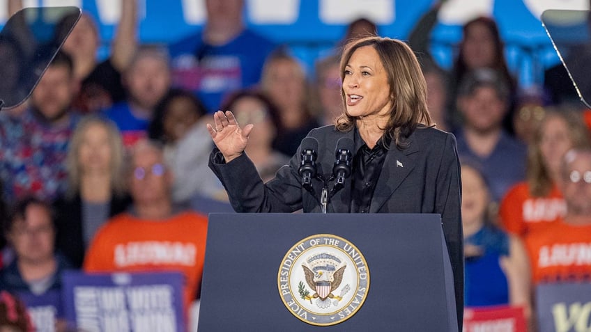 Kamala Harris at rally behind lectern