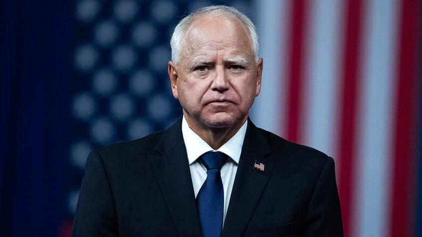 Minnesota Governor Tim Walz in front of US flag in Philly in Aug. 2024