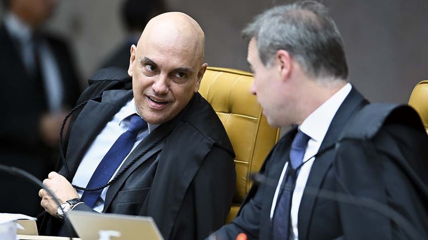 Alexandre de Moraes, justice of Brazil's Supreme Federal Court, left, speaks during a session at the Supreme Court building in Brasilia, Brazil, on Wednesday, April 17, 2024. Elon Musk's X social media platform will comply with all orders from Brazil's Supreme Court, a week following top Justice Moraes's decision to open an investigation into Musk and the billionaire saying he would defy the court.