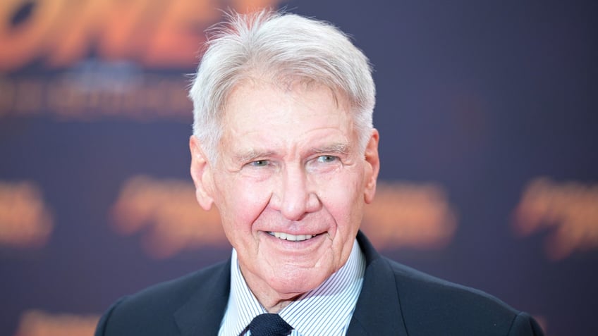 Harrison Ford smiles on the red carpet for "Indiana Jones"