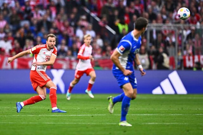 harry kane imitates david beckham by scoring from his own half for bayern munich