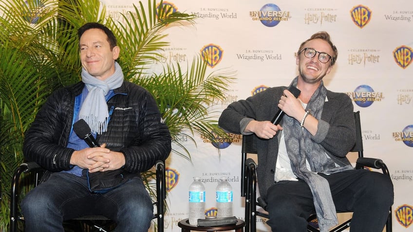 Jason Isaacs (L) and Tom Felton