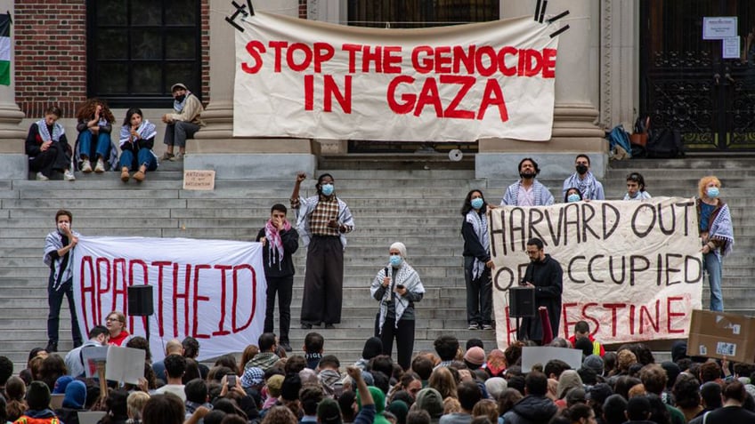 harvard students stage march die in blaming israel for hospital blast genocide in gaza