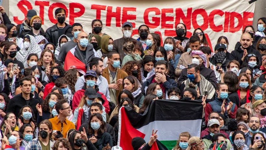 harvard students stage march die in blaming israel for hospital blast genocide in gaza