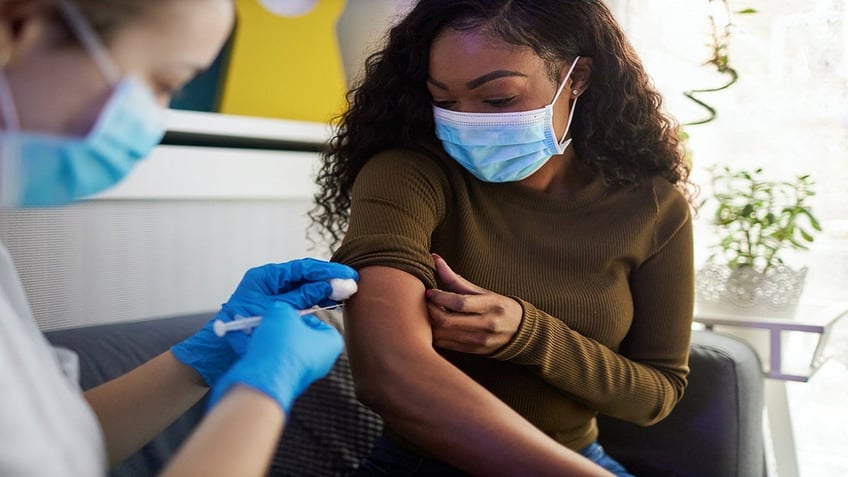 Woman getting vaccinated