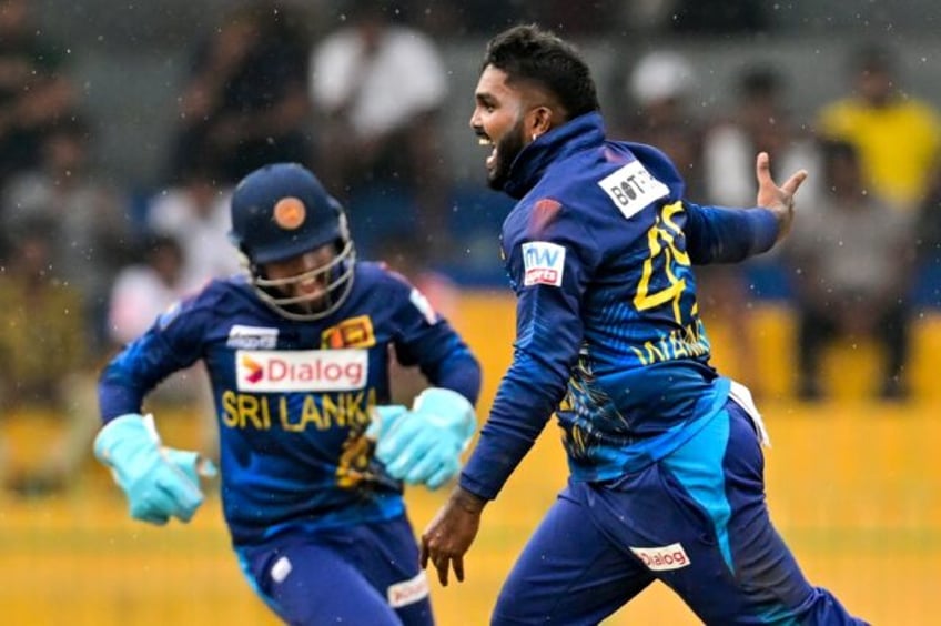 Leg-spinner Wanindu Hasaranga (R) took 7-19 as Sri Lanka skittled Zimbabwe for 96 in the third and final OCI against Zimbabwe in Colombo