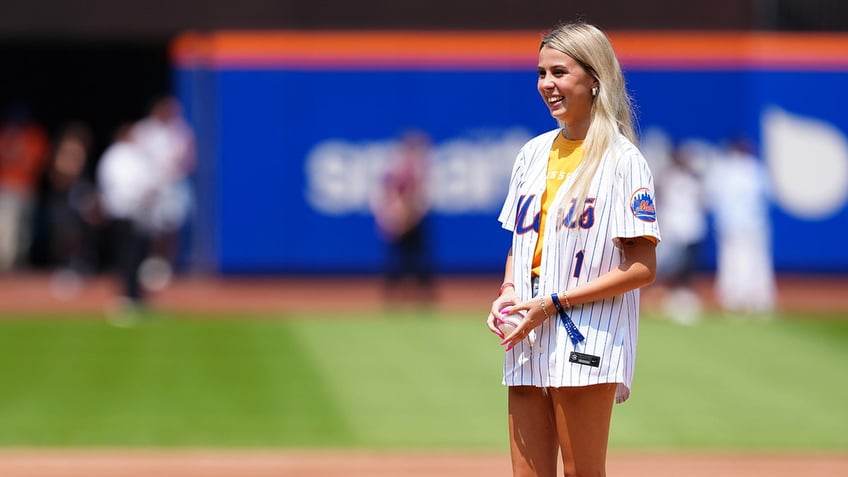 Haliey Welch throws out the first pitch