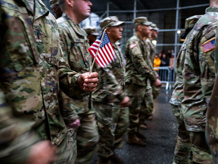 NEW YORK, NEW YORK - NOVEMBER 11: Members of the military march in the annual Veterans Day