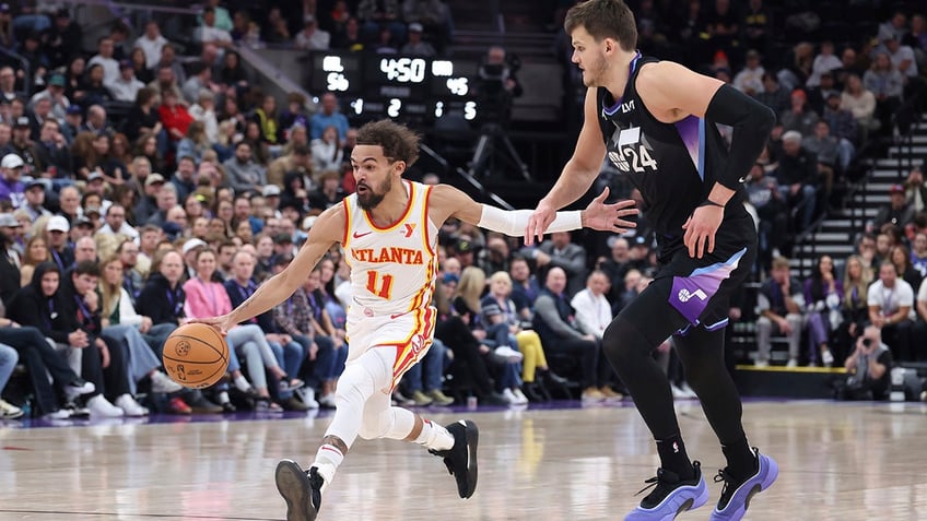 Trae Young looks for space