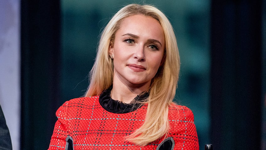 Hayden Panettiere wears red suit.