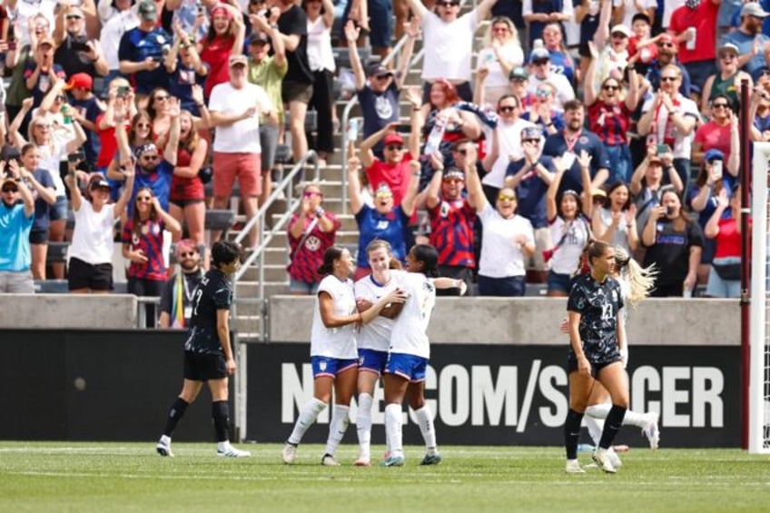 US defender Tierna Davidson is congratulated after scoring the first of her two goals in S