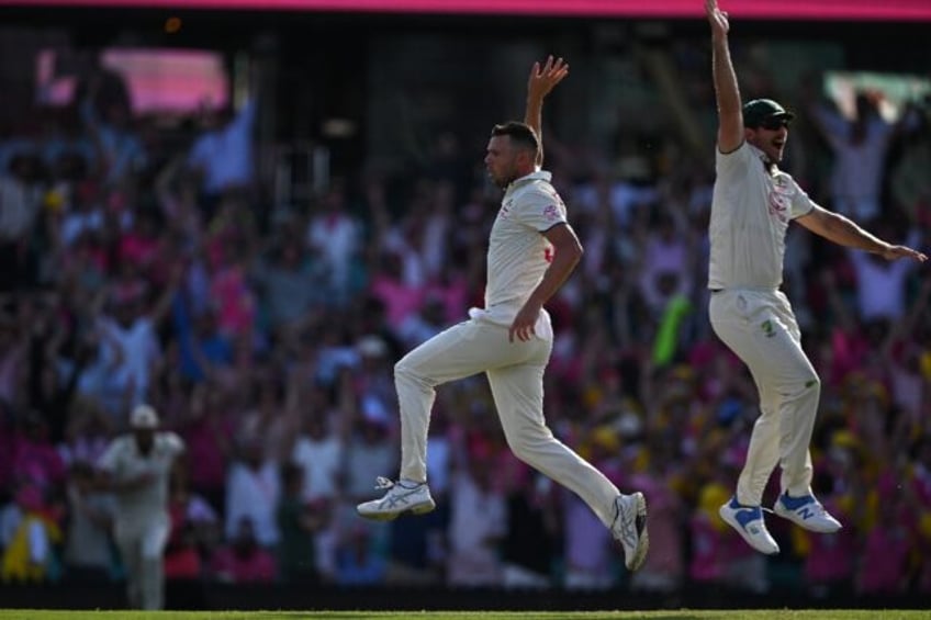 Australia's Josh Hazlewood (left) celebrates a wicket with Mitchell Marsh against Pakistan