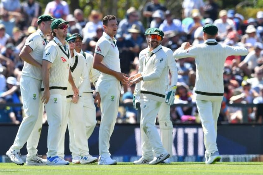 Australia seamer Josh Hazlewood (C) celebrates the wicket of New Zealand's Kane Williamson