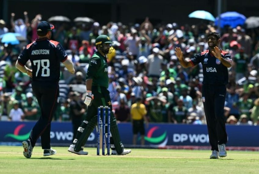 USA's Saurabh Netravalkar (R) celebrates his dismissal of Pakistan's Iftikhar Ahmed (C) in