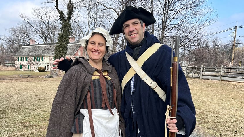 A.J. Jacobs and wife in regalia coat and outfit