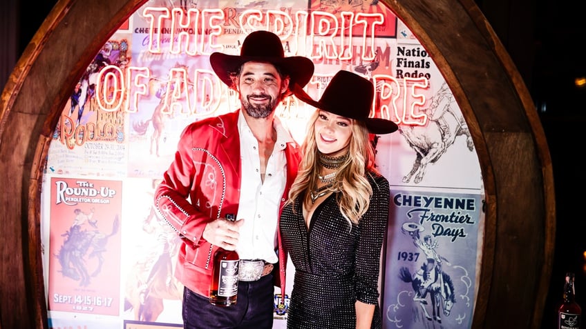 Ryan Bingham and Hassie Harrison pose for a photograph while attending an event on Dec. 07, 2023, in Las Vegas.