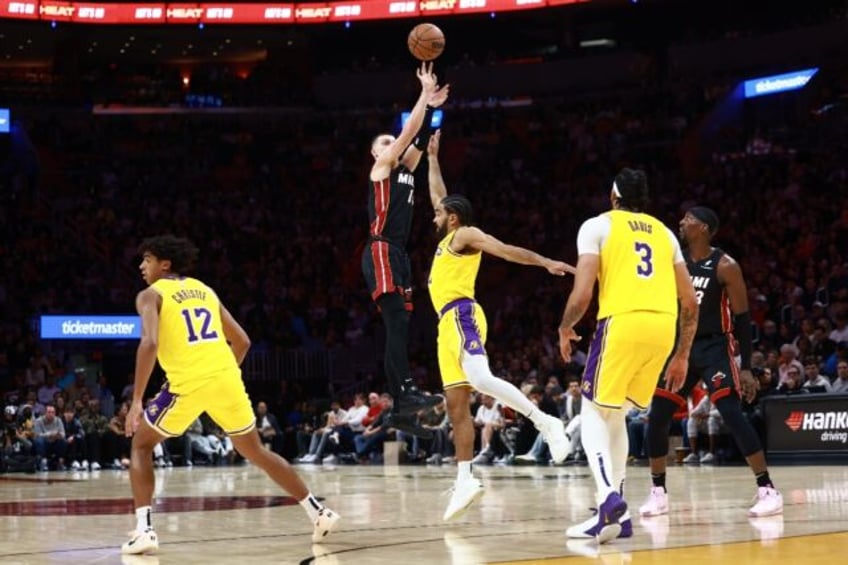 Miami's Tyler Herro shoots a three-point basket in the Heat's NBA victory over the Los Ang