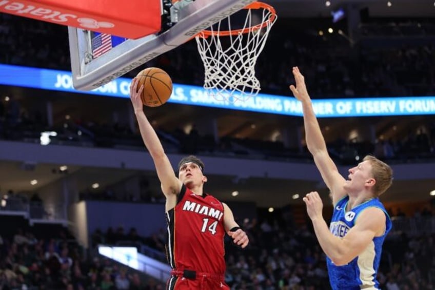 Tyler Herro drives to the basket in Miami's rout of Milwaukee