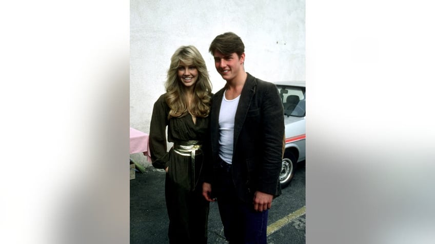 Heather Locklear and Tom Cruise smiling