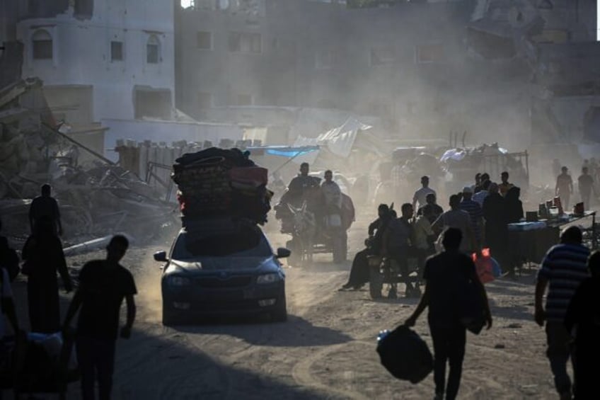 Palestinians flee after the Israeli army issued evacuation orders for vast southern areas