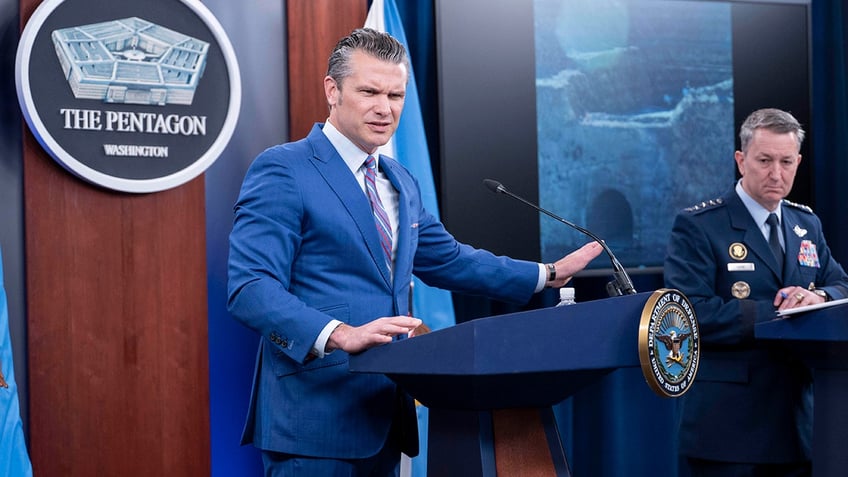 U.S. Defense Secretary Pete Hegseth and Chairman of the Joint Chiefs of Staff Air Force General Dan Caine speak at a Pentagon briefing