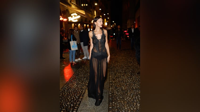 Irina Shayk wore a sheer black dress at The Vogue Italia 60th Anniversary X Ray-Ban event.