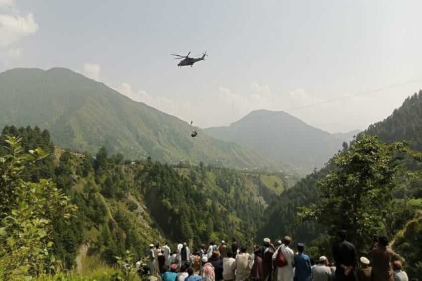 helicopters zipliners rescue 4 children from cable car over pakistan valley