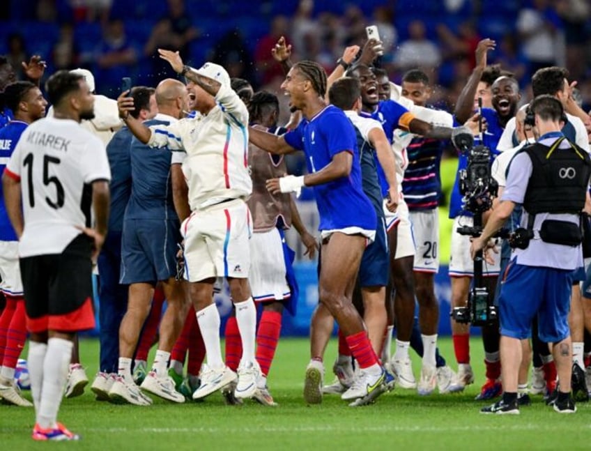 France players celebrate after beating Egypt to reach the Olympic men's football final