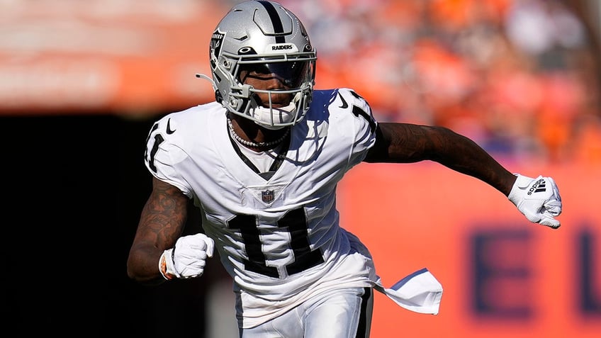 FILE - Las Vegas Raiders wide receiver Henry Ruggs III in action against the Denver Broncos during an NFL football game, Oct. 17, 2021, in Denver. Police in Las Vegas said Ruggs is facing a driving under the influence charge after a fiery vehicle crash early Tuesday, Nov. 2, 2021, that left a woman dead and Ruggs and his female passenger injured.