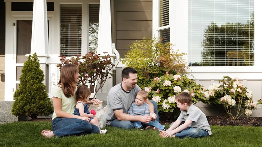 Family in home front yard